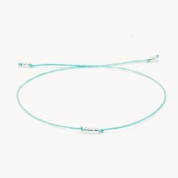 Bransoletka srebrna na miętowym sznurku na szczęście z trzema kuleczkami