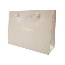 Kremowe opakowanie prezentowe ze złotym nadrukiem