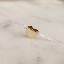 Bransoletka pozłacana serduszko na białym sznurku